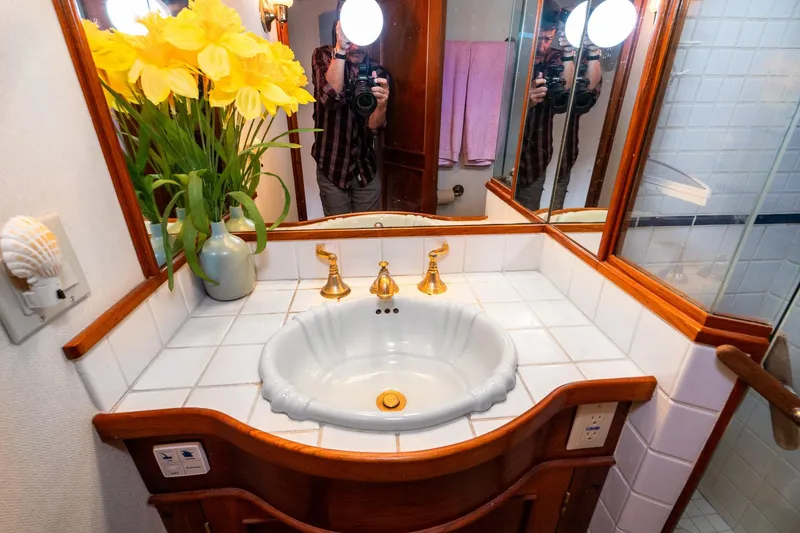 Slide: The Image of Bathroom with yellow flowers and mirror in Philbrook's Trawler 1971. - 39