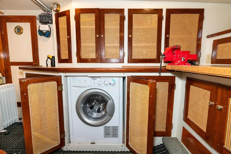 Slide: The Image of Interior of a 1971 Philbrook's Trawler featuring a washing machine. - 45