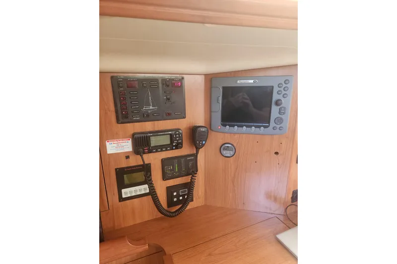 Slide: The Image of Control panel of a 2008 Hunter 450 sailboat with navigation equipment. - 11
