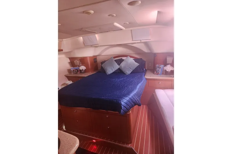 Slide: The Image of Luxurious cabin interior of 2008 Hunter 450 yacht with cozy bed and elegant decor. - 16