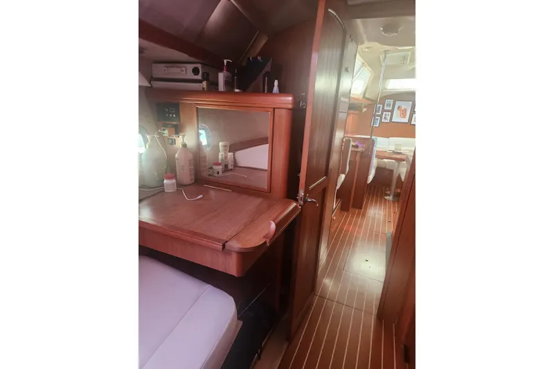 Slide: The Image of Interior of 2008 Hunter 450 yacht with wooden furnishings and cozy cabin space. - 17