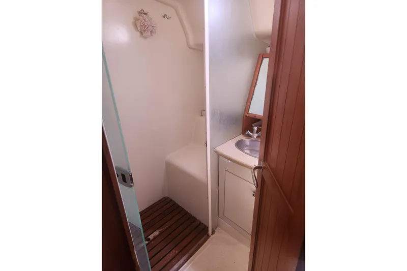 Slide: The Image of Compact bathroom in 2008 Hunter 450 yacht with shower and sink. - 18