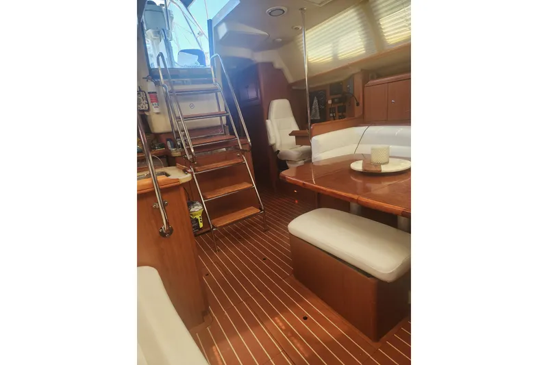 Slide: The Image of Interior of 2008 Hunter 450 yacht with wooden flooring and cozy seating area. - 7