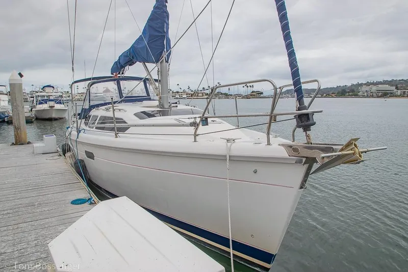 Slide: The Image of Sailboat docked at marina, 1995 Hunter 336 model, overcast sky. - 2