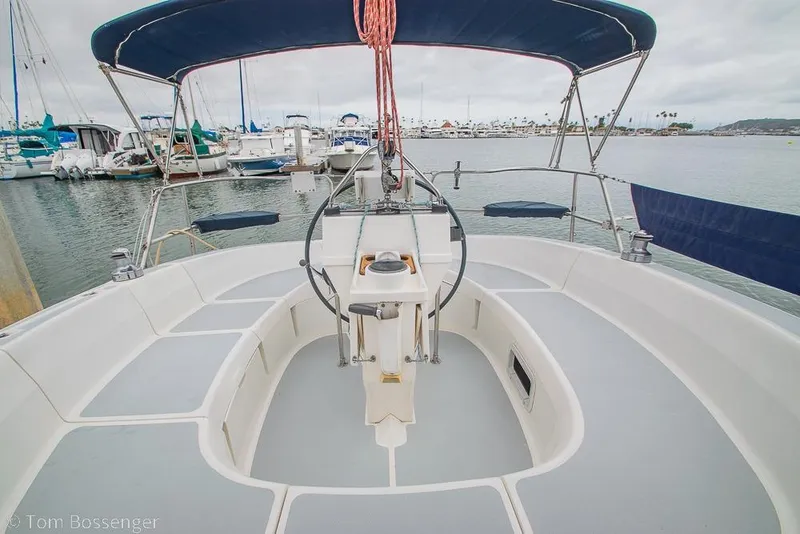 Slide: The Image of Cockpit view of a 1995 Hunter 336 sailboat docked in a marina. - 21