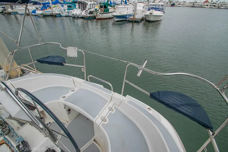 Slide: The Image of Cockpit view of a 1995 Hunter 336 sailboat docked in a marina. - 24