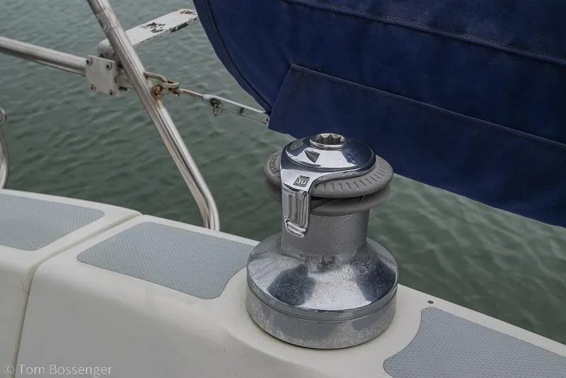 Slide: The Image of Winch on a 1995 Hunter 336 sailboat deck, near water. - 25