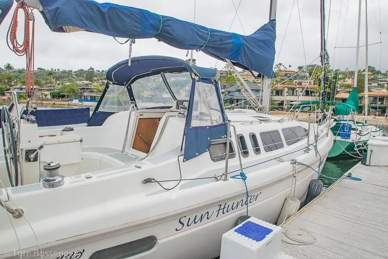 Slide: The Image of Sailboat "Sun Hunter" docked, 1995 Hunter 336 model, marina background. - 3