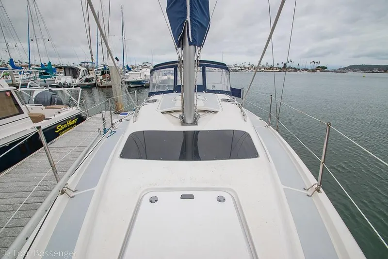 Slide: The Image of Sailboat Hunter 336, 1995 model, docked at marina with overcast sky. - 30
