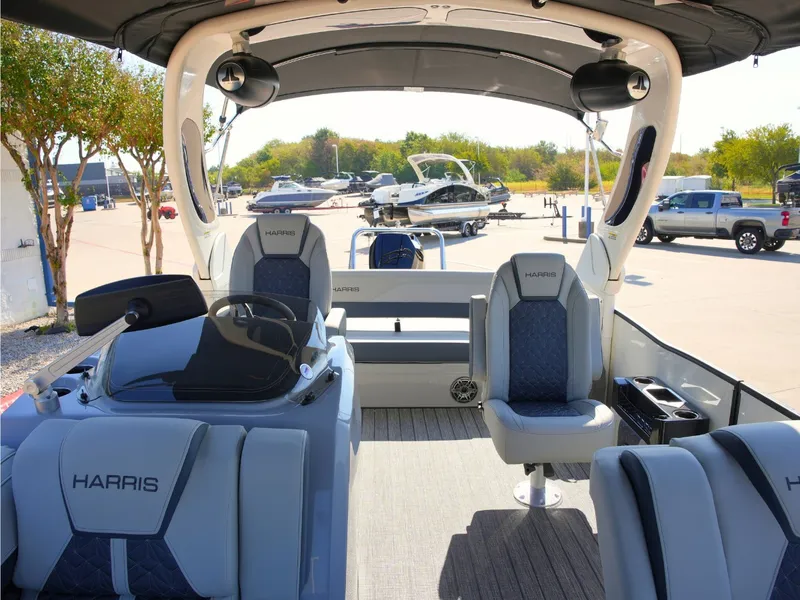 Slide: The Image of The image shows the interior of a 2027 Harris Grand Mariner 250 with sleek seating and a modern helm. - 15