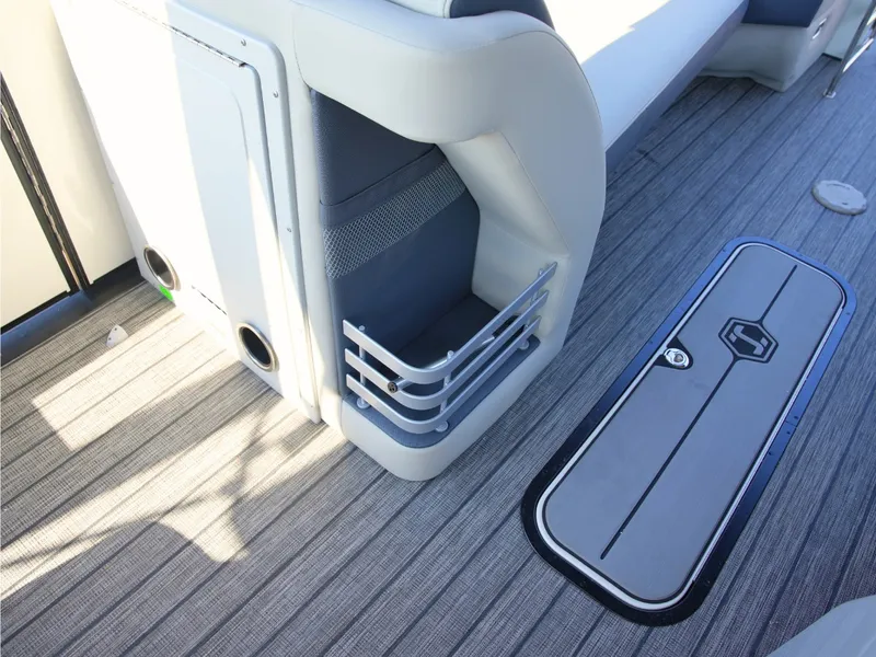 Slide: The Image of The image shows the interior of a 2027 Harris Grand Mariner 250 with gray flooring. - 14