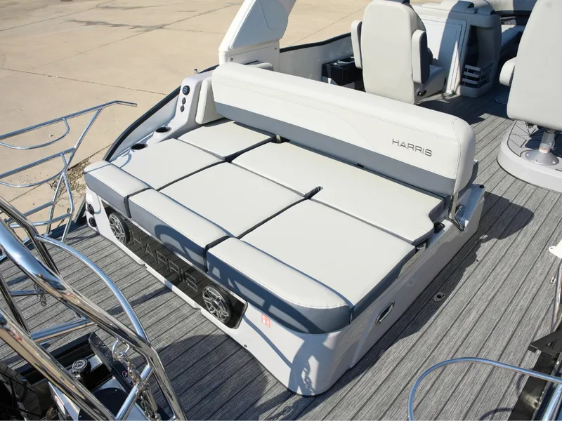 Slide: The Image of The image shows the deck of a 2027 Harris Grand Mariner 250 with gray upholstery and modern features. - 30