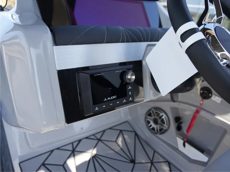 Slide: The Image of The image shows the dashboard of a 2027 Harris Grand Mariner 250 with a JL Audio system. - 21