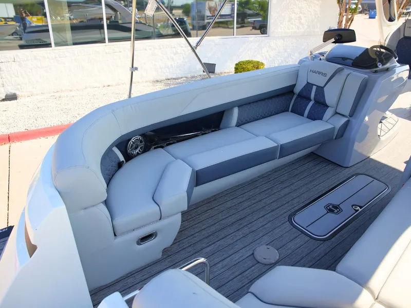 Slide: The Image of The image shows the interior of a 2027 Harris Grand Mariner 250 with sleek gray seating. - 7