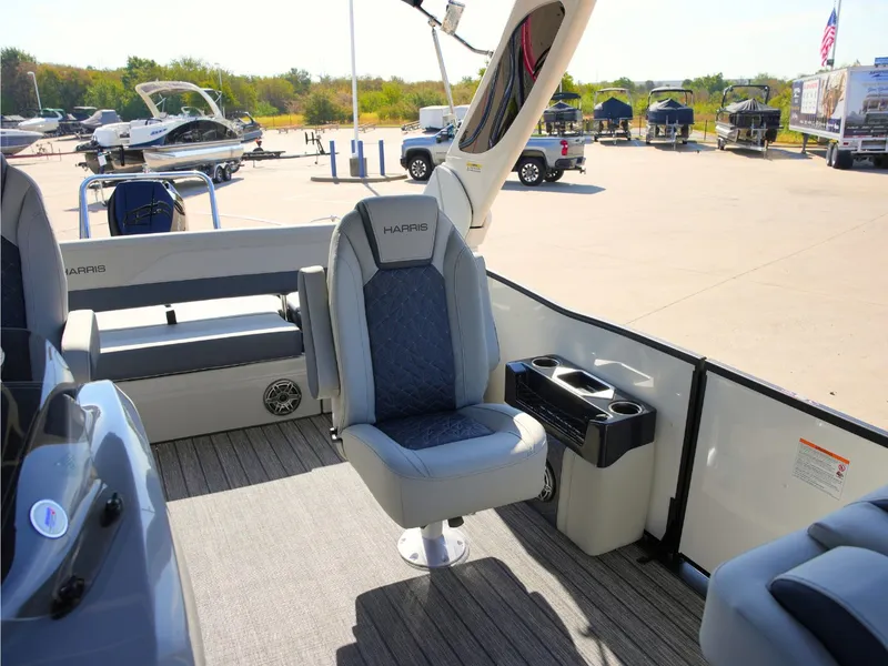 Slide: The Image of The image shows the interior of a 2027 Harris Grand Mariner 250 with luxurious seating. - 16