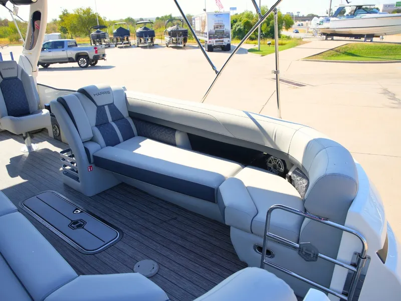 Slide: The Image of The image shows the spacious deck of a 2027 Harris Grand Mariner 250 with elegant seating. - 8