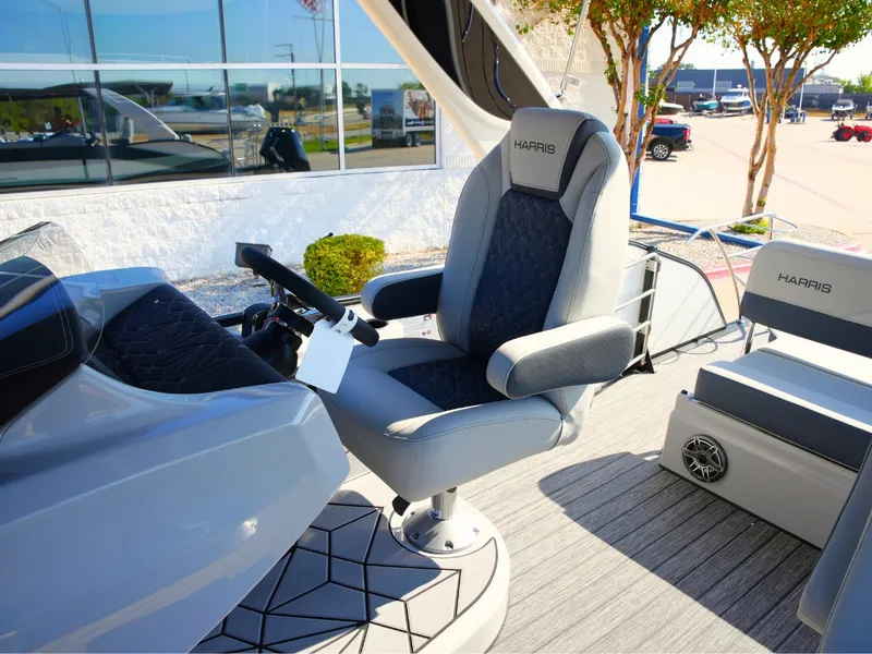Slide: The Image of The 2027 Harris Grand Mariner 250 features a luxurious captain's chair with a modern design. - 19