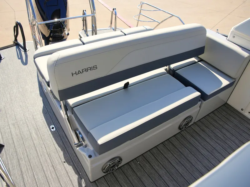 Slide: The Image of The 2027 Harris Grand Mariner 250 features a sleek, cushioned bench seat with integrated speaker. - 27