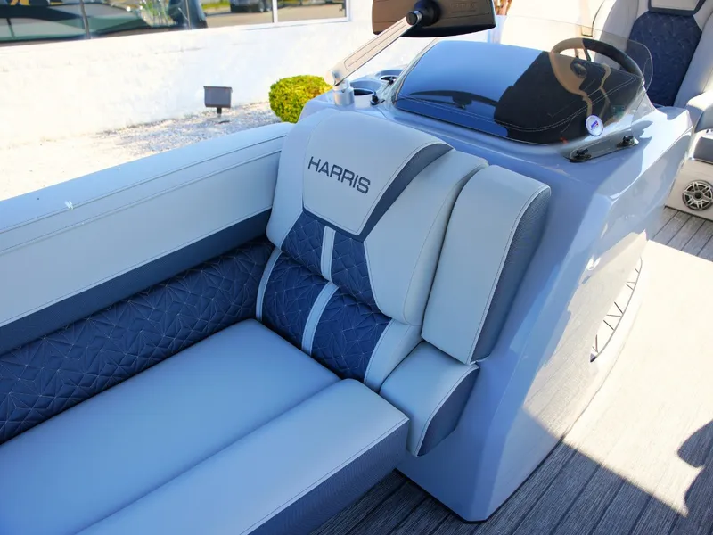 Slide: The Image of The image shows the luxurious cockpit of a 2027 Harris Grand Mariner 250 with elegant upholstery. - 10