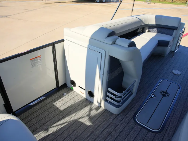 Slide: The Image of The image shows the interior of a 2027 Harris Grand Mariner 250 with gray seating and wood flooring. - 12