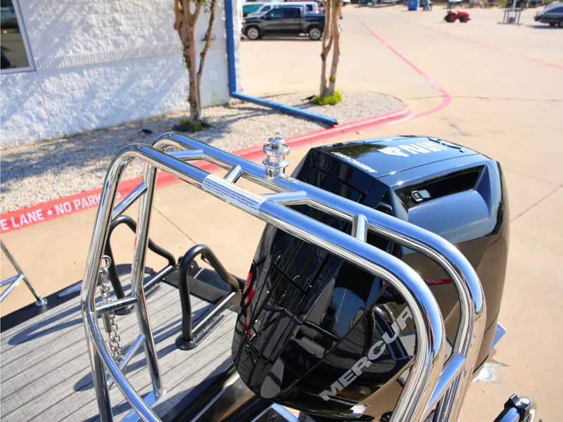 Slide: The Image of The image shows the engine of a 2027 Harris Grand Mariner 250 with shiny metal railings. - 36