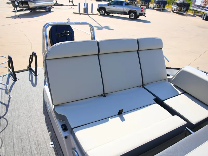 Slide: The Image of The image shows the deck of a 2027 Harris Grand Mariner 250 with beige upholstery. - 33