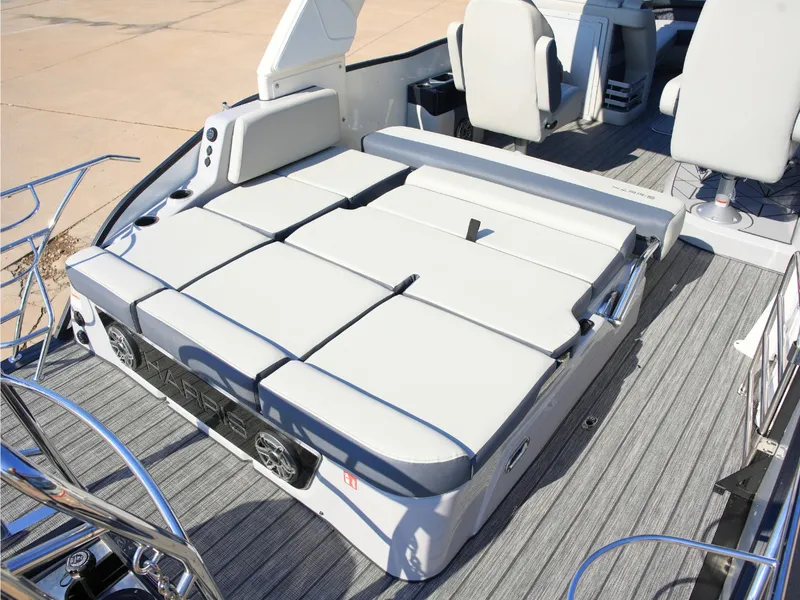 Slide: The Image of The image shows the deck of a 2027 Harris Grand Mariner 250 with gray cushions. - 32