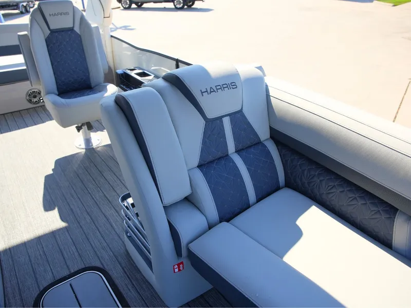 Slide: The Image of The 2027 Harris Grand Mariner 250 features luxurious, cushioned seating with blue and gray accents. - 11