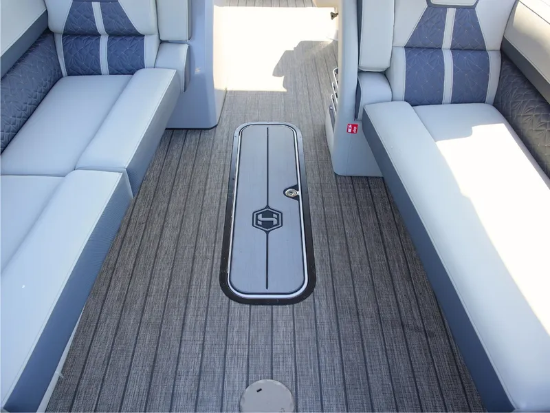 Slide: The Image of Interior of a 2027 Harris Grand Mariner 250 with gray and blue upholstery. - 9