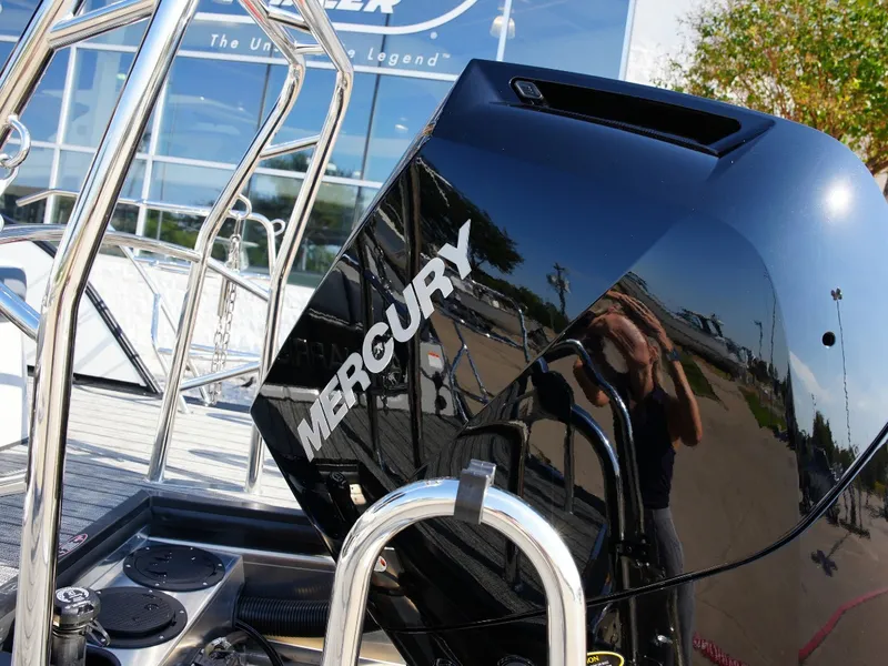 Slide: The Image of Close-up of a Mercury outboard motor on a 2027 Harris Grand Mariner 250. - 5