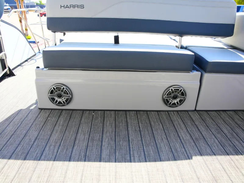 Slide: The Image of The 2027 Harris Grand Mariner 250 features a cushioned bench seat with built-in speakers. - 28