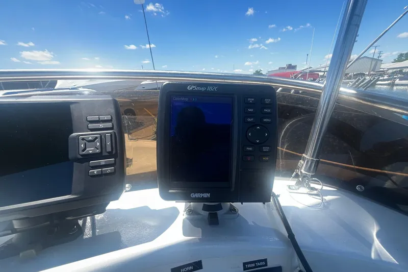 Slide: The Image of Garmin GPS device on 1988 Seafox 29 Flybridge boat under clear blue sky. - 9