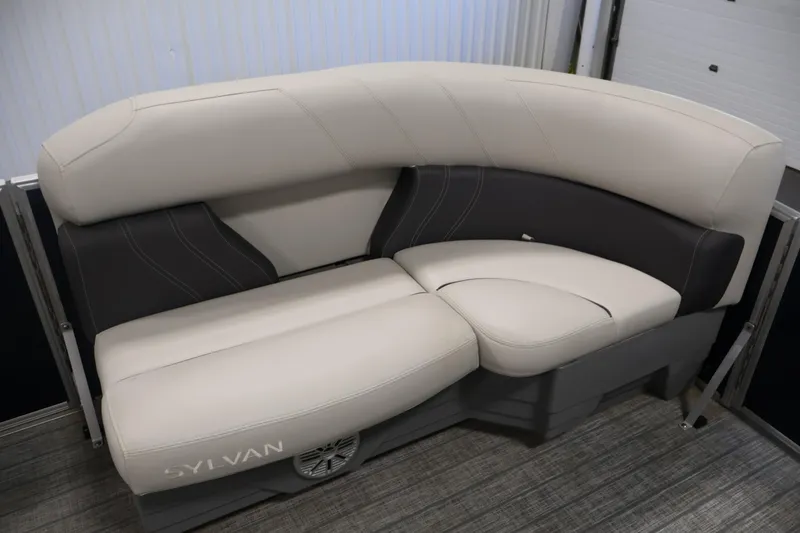 Slide: The Image of Luxurious seating on 2022 Sylvan 8520 Mirage pontoon boat, featuring elegant beige and gray upholstery. - 12