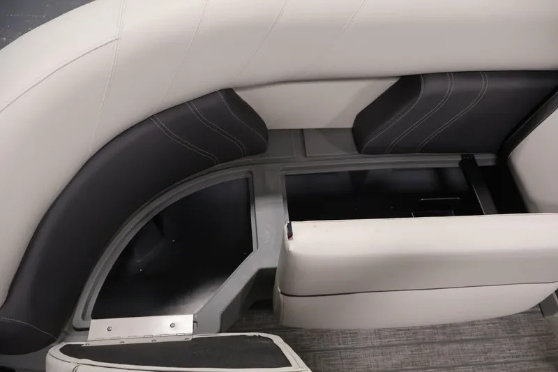 Slide: The Image of 2022 Sylvan 8520 Mirage boat interior storage compartment with cushioned seating. - 15