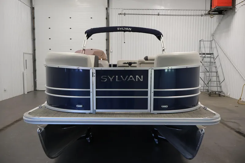 Slide: The Image of 2022 Sylvan 8520 Mirage pontoon boat in a showroom, front view. - 2
