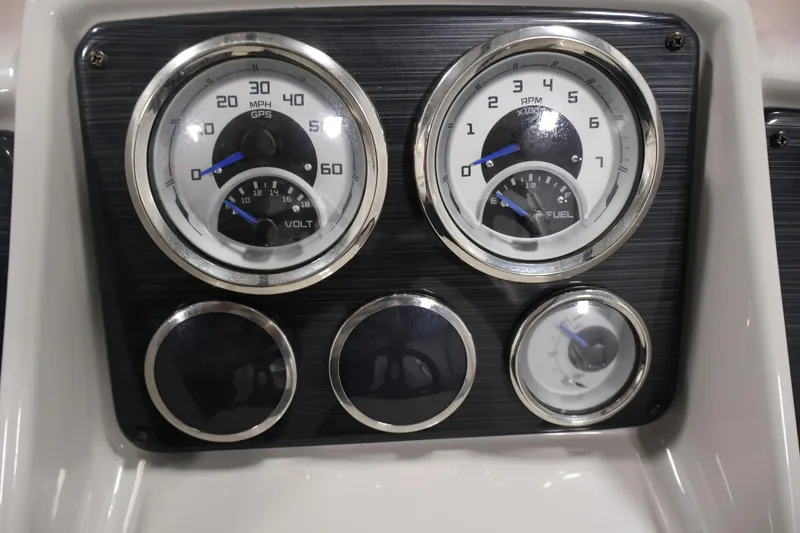 Slide: The Image of Dashboard gauges of a 2022 Sylvan 8520 Mirage boat, displaying speed, RPM, voltage, and fuel levels. - 20