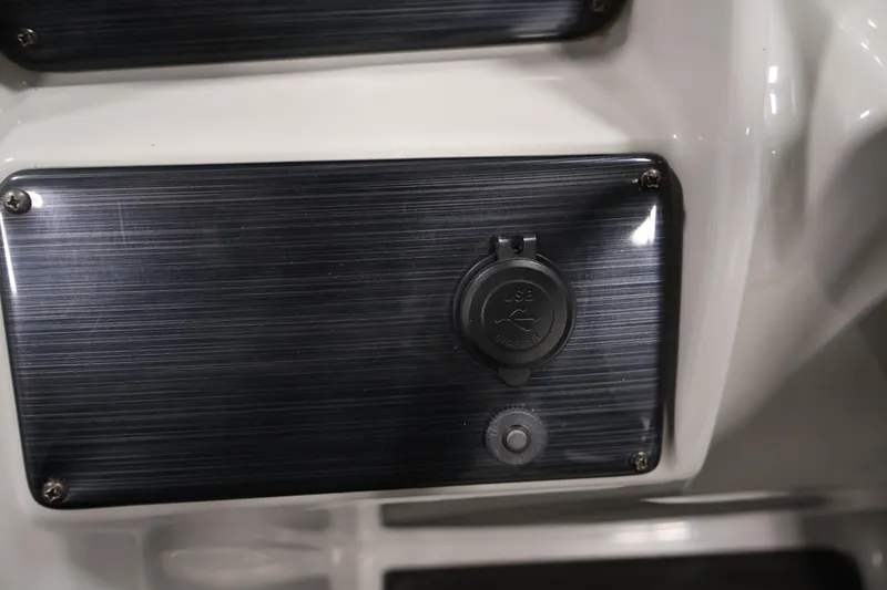 Slide: The Image of USB charging port on 2022 Sylvan 8520 Mirage boat dashboard. - 21