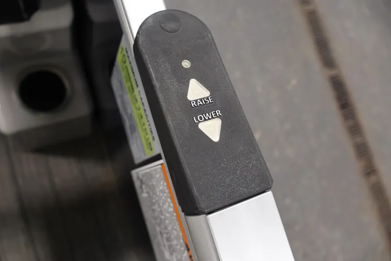 Slide: The Image of Close-up of 2022 Sylvan 8520 Mirage control panel with raise and lower buttons. - 23