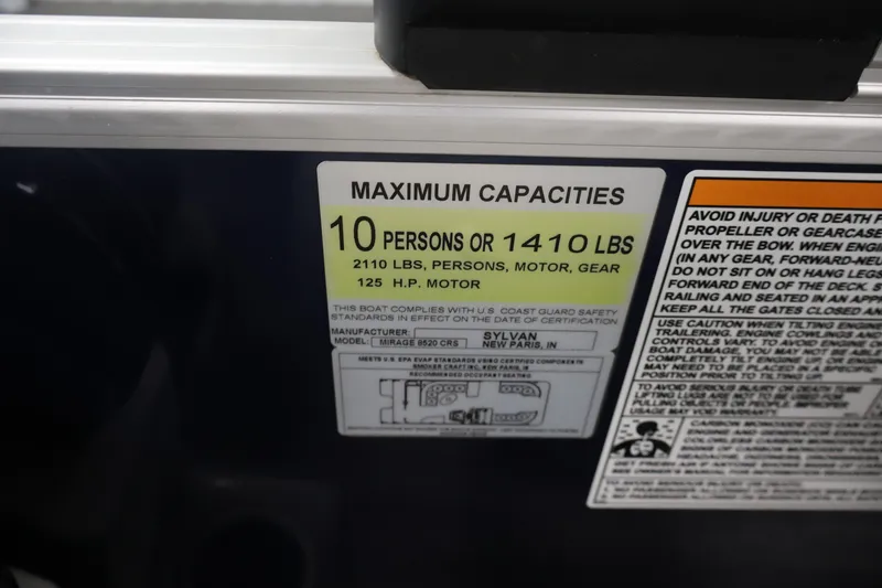 Slide: The Image of Maximum capacity label on 2022 Sylvan 8520 Mirage boat, 10 persons or 1410 lbs. - 24