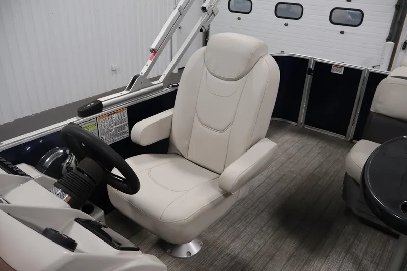 Slide: The Image of Captain's chair in 2022 Sylvan 8520 Mirage pontoon boat interior. - 25