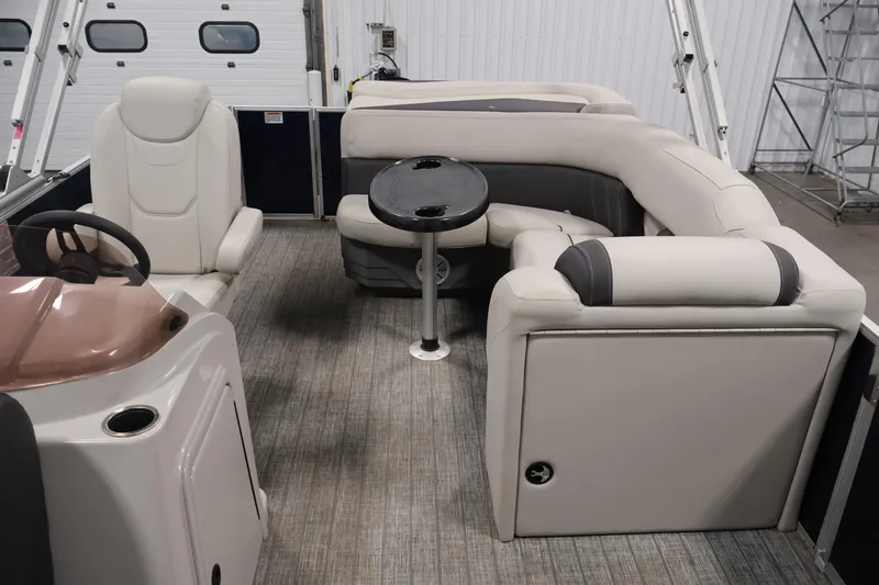 Slide: The Image of 2022 Sylvan 8520 Mirage boat interior with plush seating and steering console. - 26