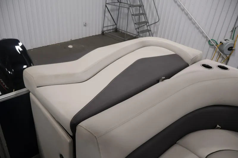Slide: The Image of 2022 Sylvan 8520 Mirage boat interior with plush seating and cup holders. - 31