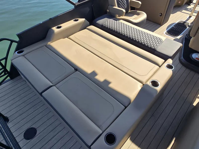 Slide: The Image of The image shows the spacious lounge seating of a 2027 Sylvan MIRAGE X3 ULZ. - 11