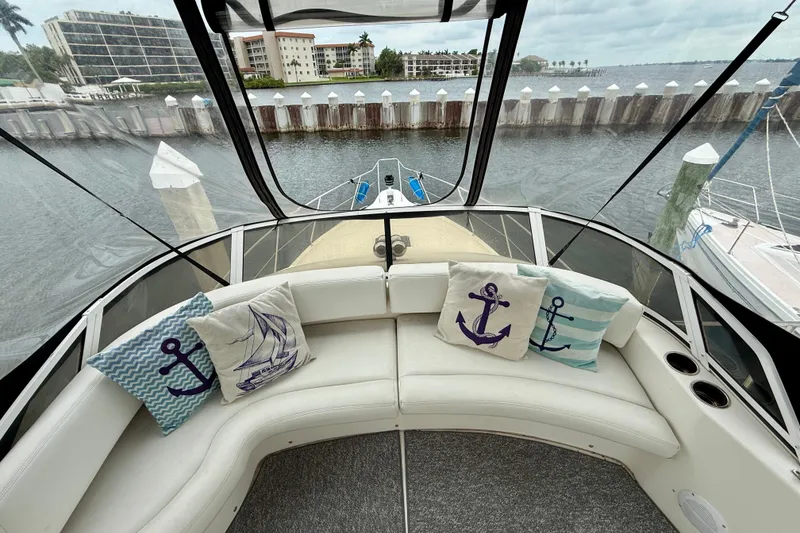 Slide: The Image of Interior view of 2000 Silverton 351 Sedan yacht with nautical-themed cushions. - 13