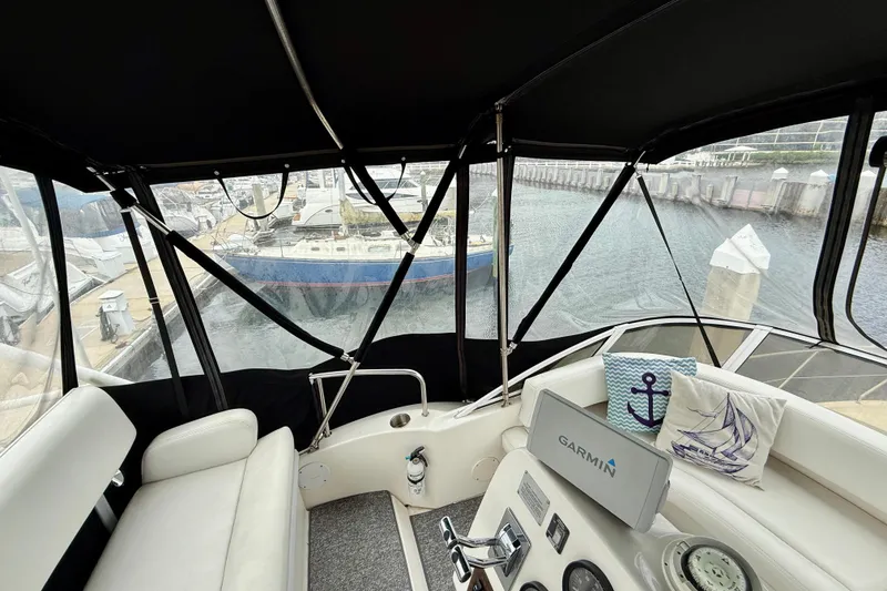 Slide: The Image of Interior view of a 2000 Silverton 351 Sedan yacht at a marina. - 14