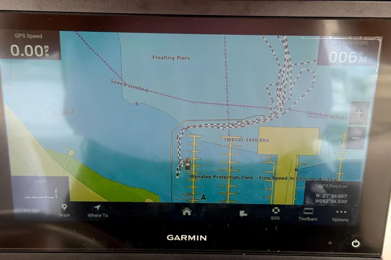 Slide: The Image of Garmin GPS display on a 2000 Silverton 351 Sedan, showing nautical map and speed data. - 21