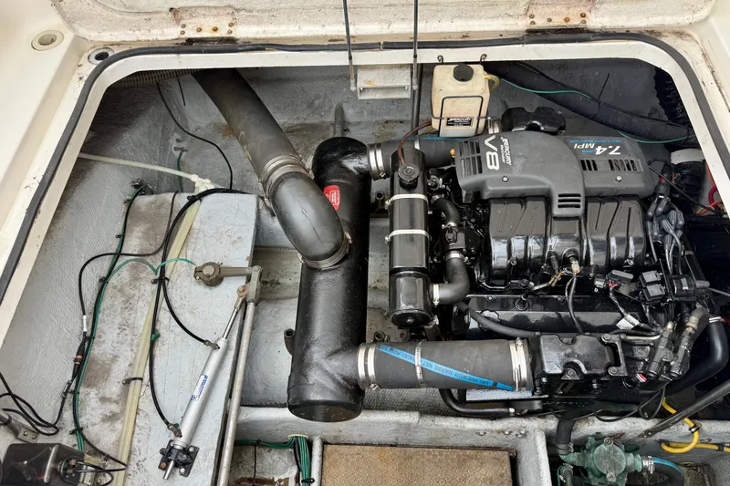 Slide: The Image of Engine compartment of a 2000 Silverton 351 Sedan with V8 engine visible. - 24