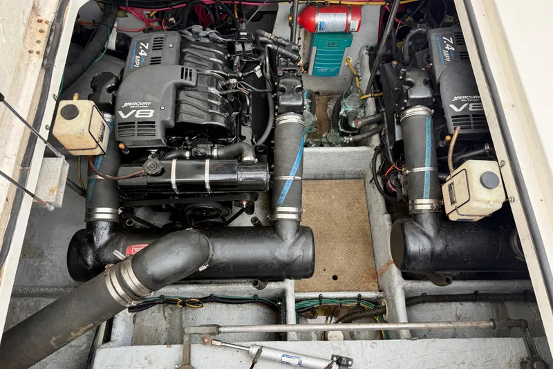 Slide: The Image of Engine compartment of a 2000 Silverton 351 Sedan with dual Mercury V8 engines. - 26