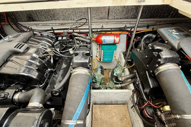 Slide: The Image of Engine compartment of a 2000 Silverton 351 Sedan with dual engines and fire extinguisher. - 27