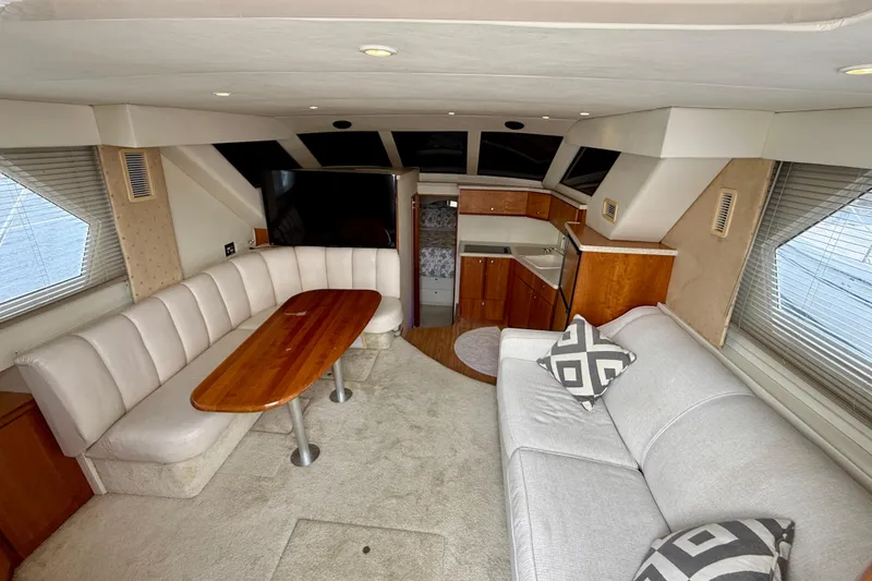 Slide: The Image of Interior of a 2000 Silverton 351 Sedan yacht with cozy seating and modern amenities. - 31